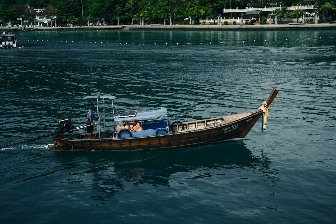 a small boat with people on it in the water